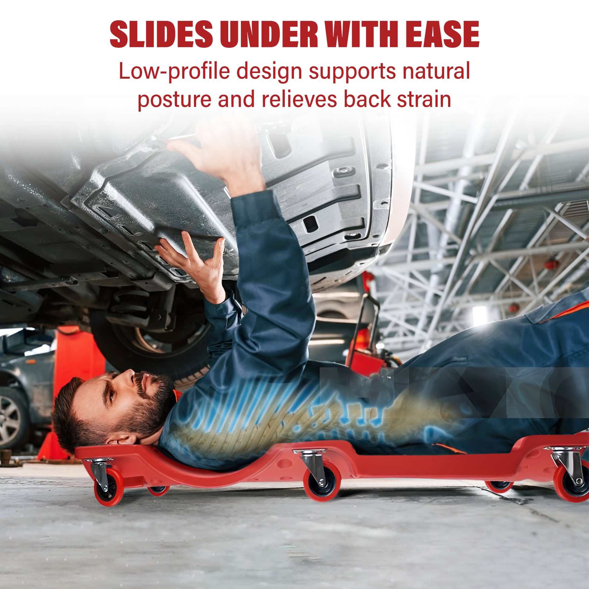 Person using a red mechanical slide under a vehicle in a garage setting.